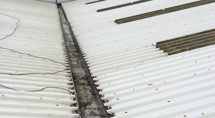 Valley gutter showing cut edge corrosion at eaves level.