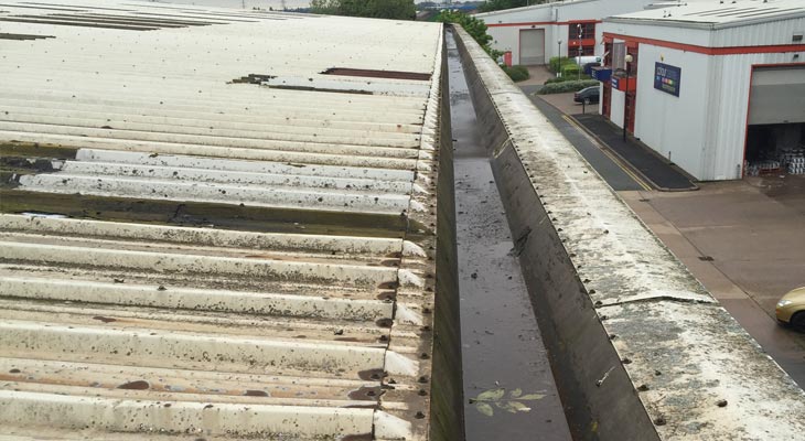 View along perimeter gutter with vegetation and debris