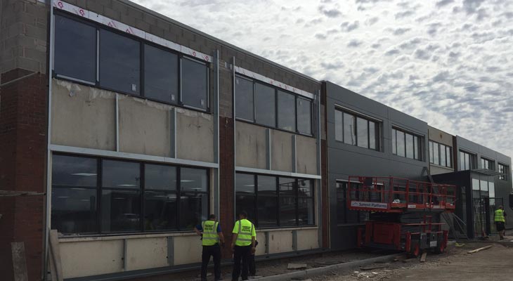 Coverclad Kingspan installers in Wrexham working along front elevation