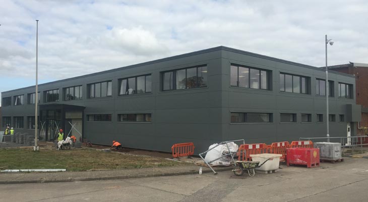 Installation of anthracite grey Kingspan wall cladding in Wrexham