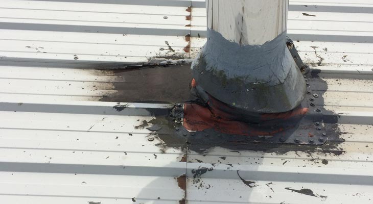 Roof penetration with water ingress from historic temporary repair