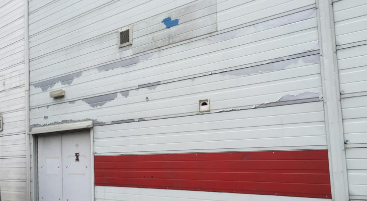 Historic wall cladding repairs to unit rear elevation