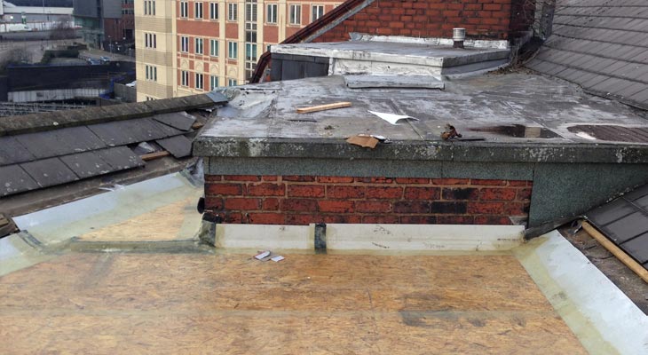 Lower flat roof area being boarded out ready for GRP application