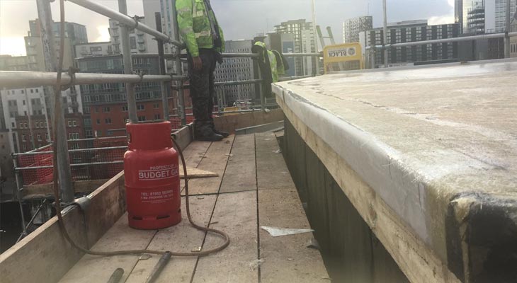 Resin being applied to plant room flat roof