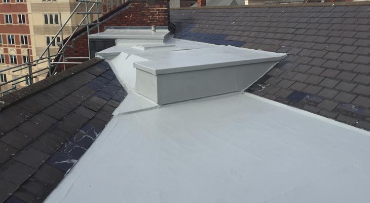 Three connected flat roofs with new GRP roofing