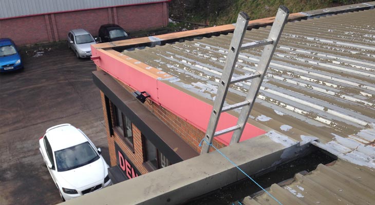 Industrial roof in Dudley with several historic temporary repairs