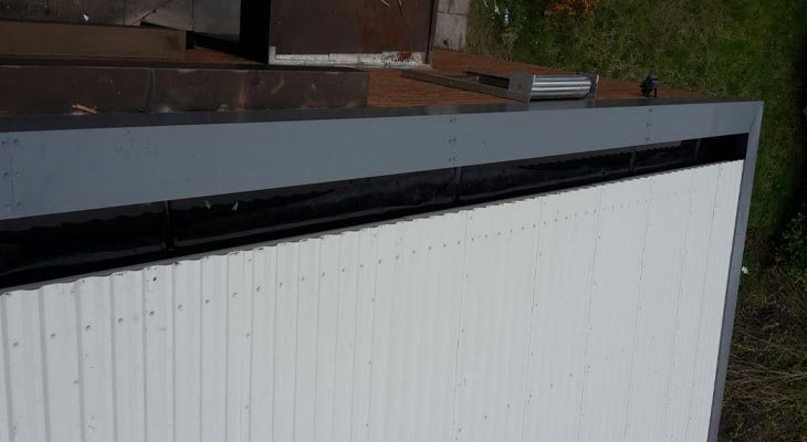 Roofing overclad with new barge flashings and Plygene Gutter Liner