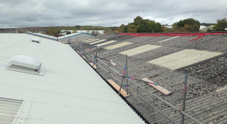 First slope completed of the asbestos roofing overclad in Dudley