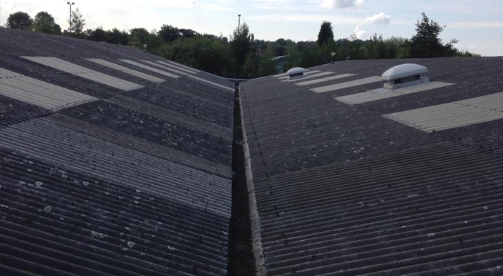 View along valley gutters of asbestos cement roof