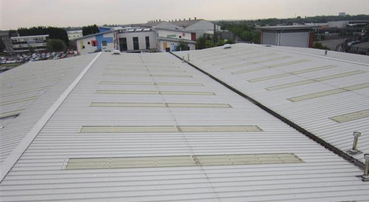 Wider view of four roof slopes with hundreds of linear meters of cut edge corrosion