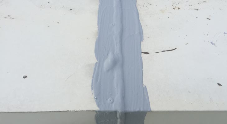 Close-up of parapet capping joint treated with Giromax