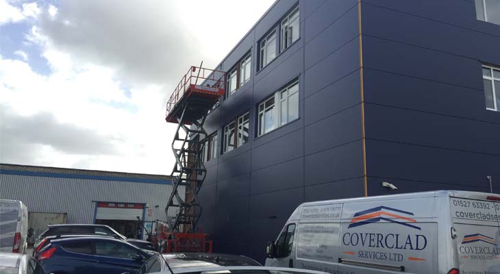 Cladding installed via scissor lift