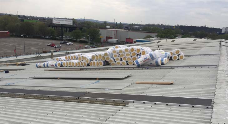 Rolls of insulation on roof