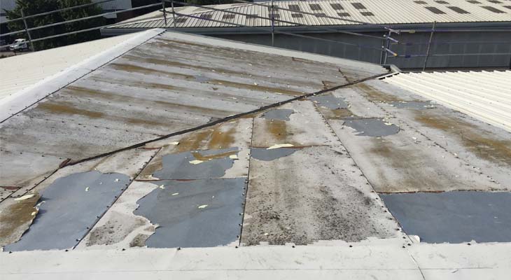 Flat plate overclad system needing repairs