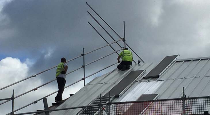 Kingspan installers fitting RW1000 composite roofing panels