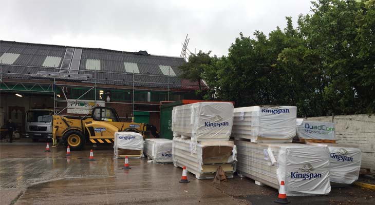 Telehandler used to hoist Kingspan RW1000 composite panels onto roof