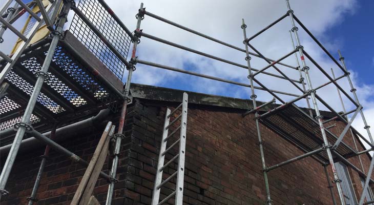 Triple handrail scaffold edge protection with access tower and walk platform