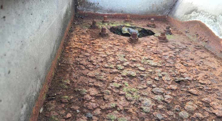 Rusted gutter outlet and bolts