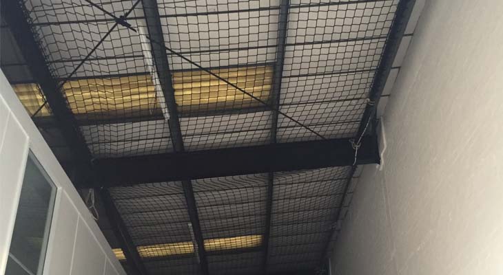 Internal safety netting installed to warehouse unit