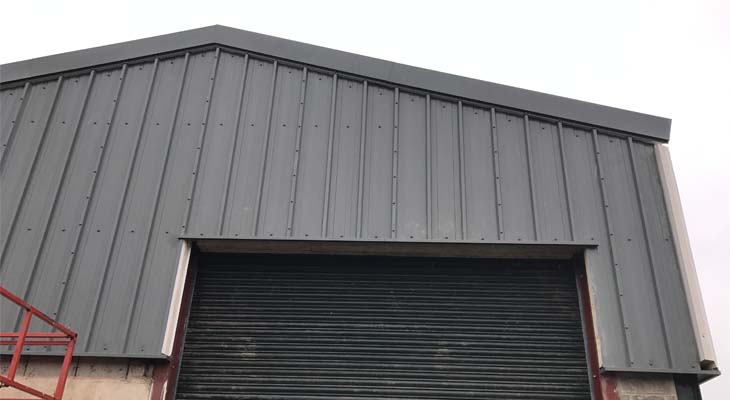 Kingspan RW1000 wall cladding installed around roller shutter door