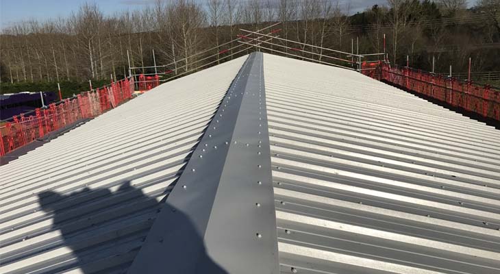 Newly installed Kingspan RW1000 composite roofing with ridge flashing