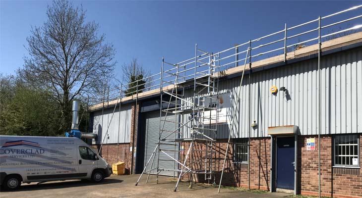 Triple handrail scaffold edge protection with access tower being erected