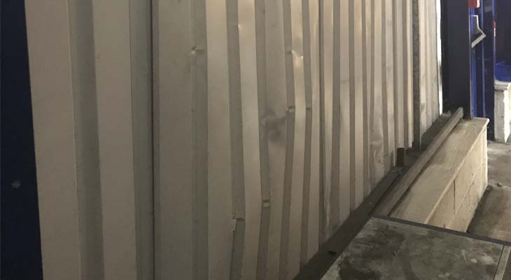 Internal wall cladding sheet pushed inwards from impact damage