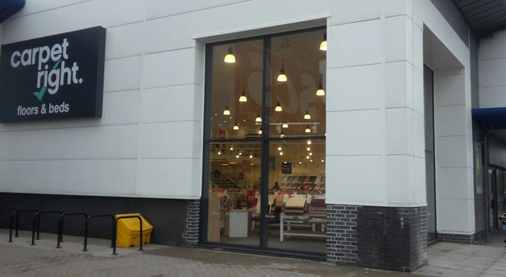 Kingspan Micro-Rib 1000 composite panels installed with new trim, flashings and top hat sections.