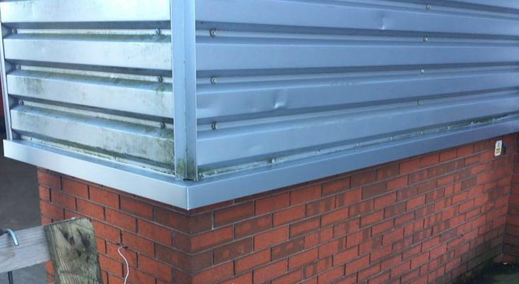 Newly installed base sill flashings in silver PVF2 finish