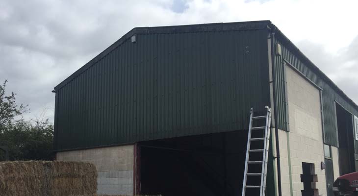 Before view of gable end with roller shutter door entrance