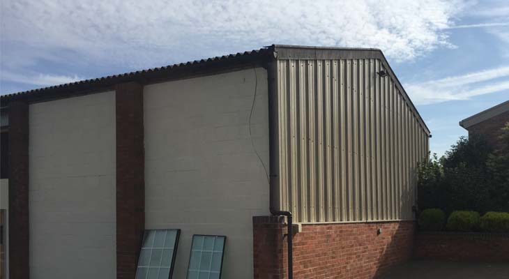 Gable end cladded in single skin metal sheets